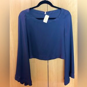 Free people cropped black top with bell sleeves. Size XS
